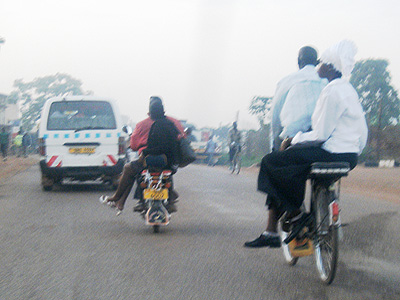 Ladies ride side-saddle on scooters